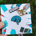 PSI Brooch